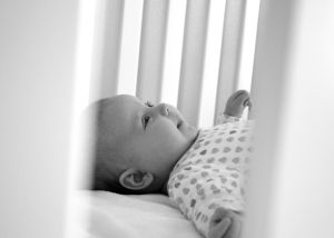 newborn in crib